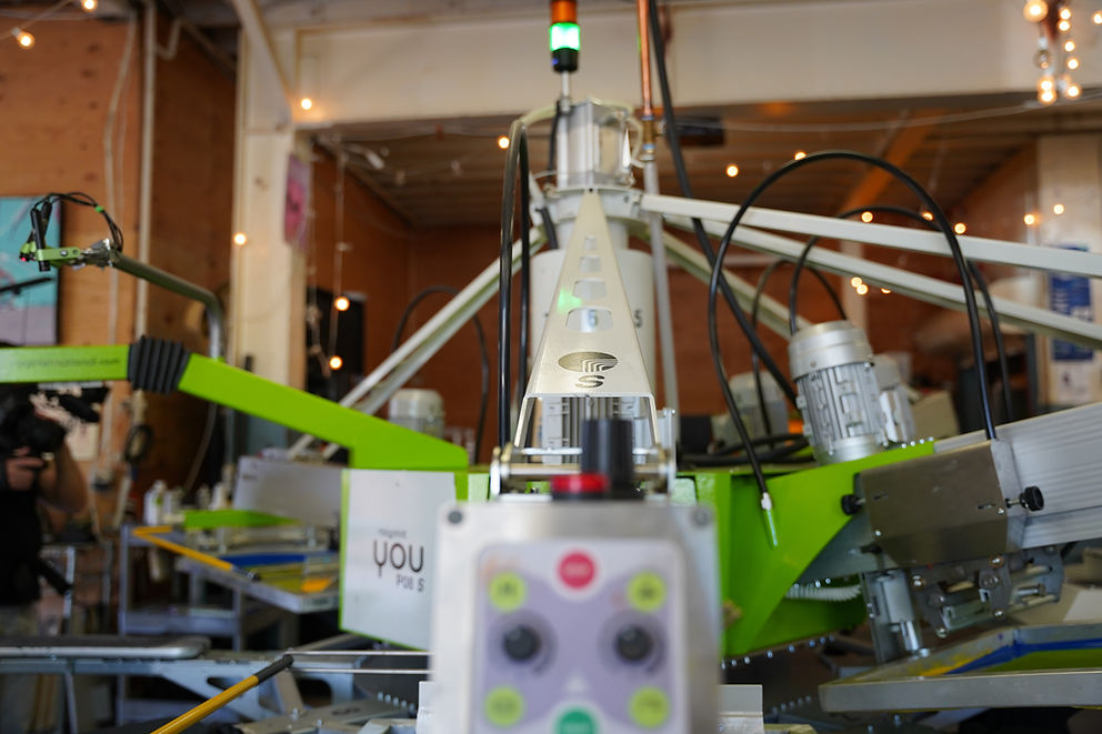 ROQ automatic screen-printing press at the Local Labels shop in Bend, Oregon